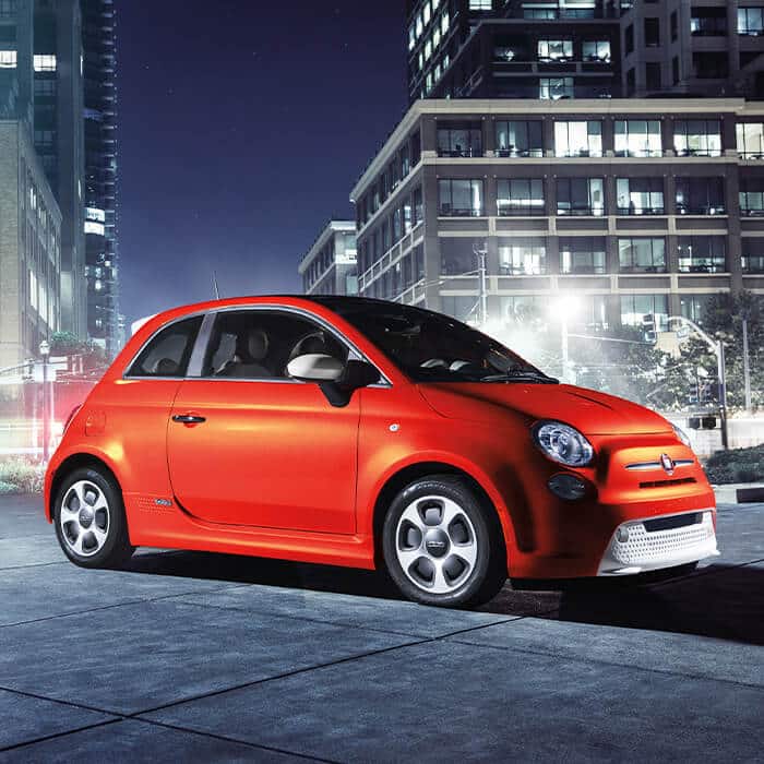 2019 Fiat 500e Electrifying In Every Way Side View Of 2019 Fiat 500e Parked In A City At Night
