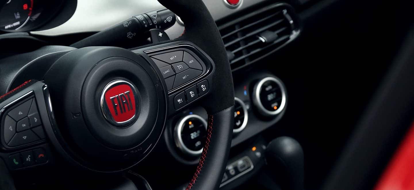 Display Close up view of the 2021 Fiat 500X Sport steering wheel.