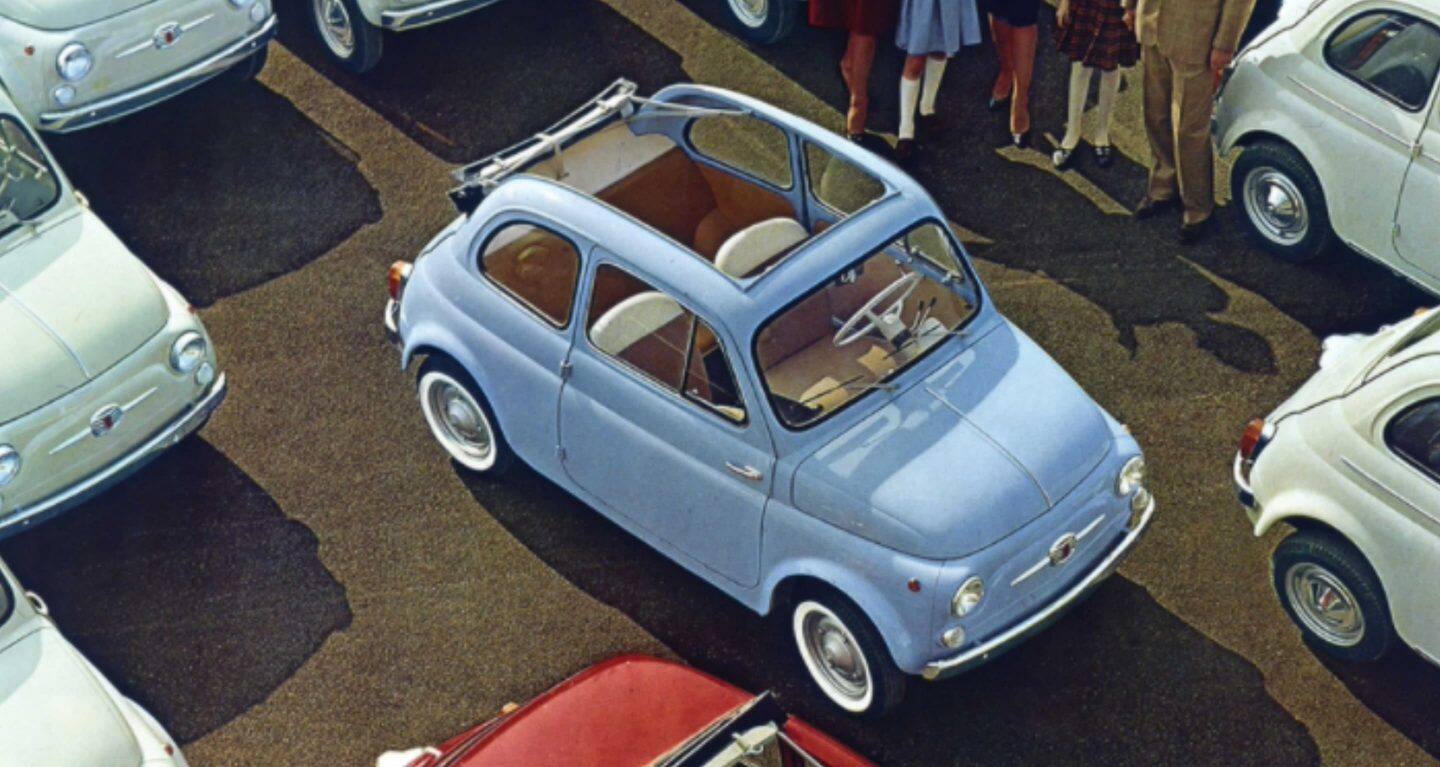 Display Wallpaper #5: A vintage drawing from above of a classic sky blue Fiat 500 Cabrio parked among several other Fiat 500 models.