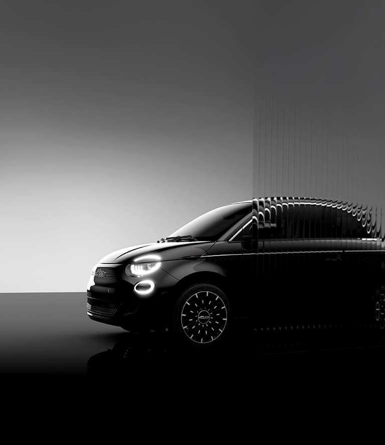 A driver-side profile of a black 2025 Fiat 500e Icona, behind it a backdrop in black and white.