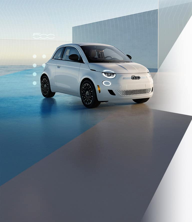 A white 2026 Fiat 500e Icona, shot from a passenger-side front angle. 500.