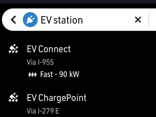 Directions to EV charging station locations displayed on the Uconnect touchscreen in a 2026 Fiat 500e.