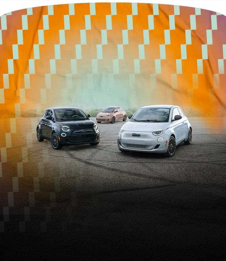 Three Fiat 500e models parked in a semicircle. From left to right: A black 2025 Fiat 500e Icona, a rose gold 2025 Fiat 500e Icona, and a blue 2025 Fiat 500e.