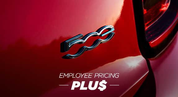 A passenger-side profile of a black Fiat 500e Red. Try it out. Try it out. Try it out.