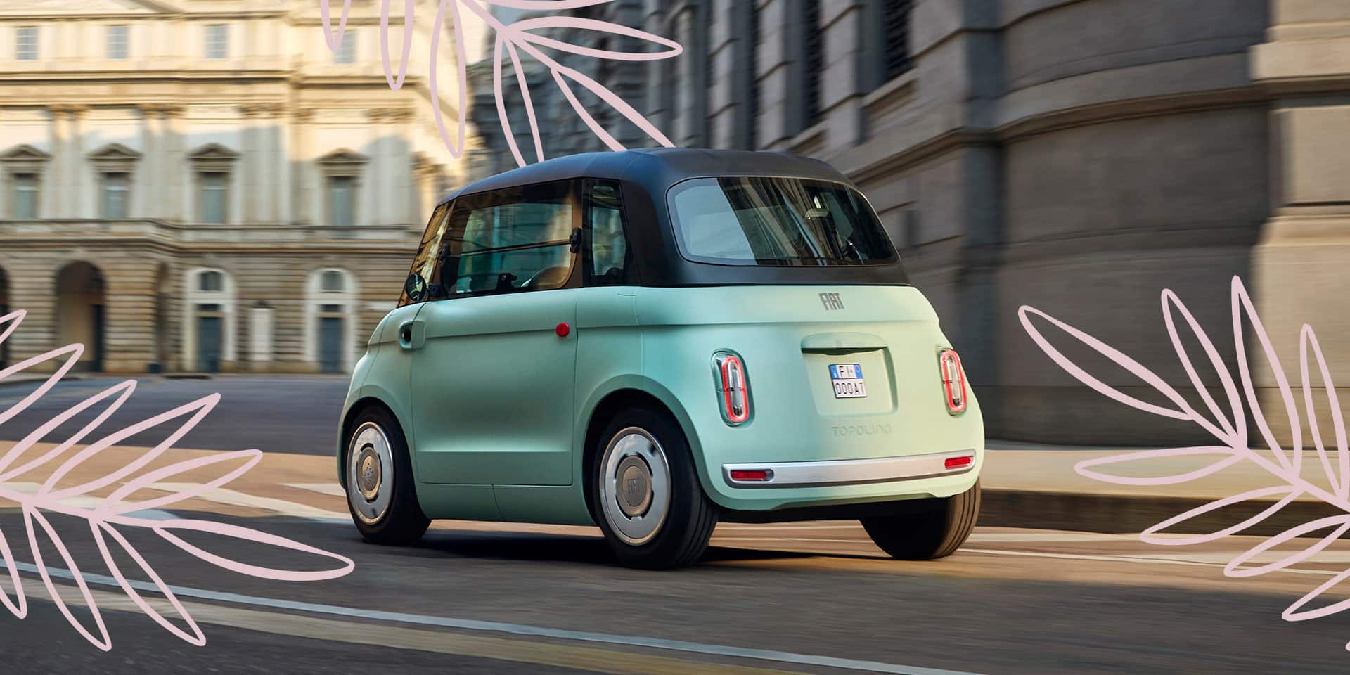 A driver-side rear angle of a mint green European model Fiat Topolino Dolce Vita with a roll-off roof, parked on a city street, with illustrated pink fronds scattered on the image.